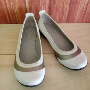 A pair of black & white slip on Privo shoes